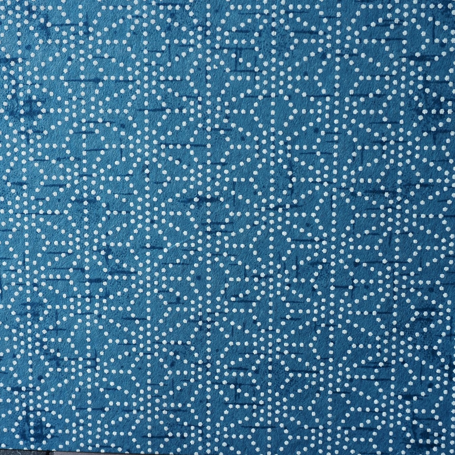 Detailed stitched textile pattern representing craftsmanship in quilting